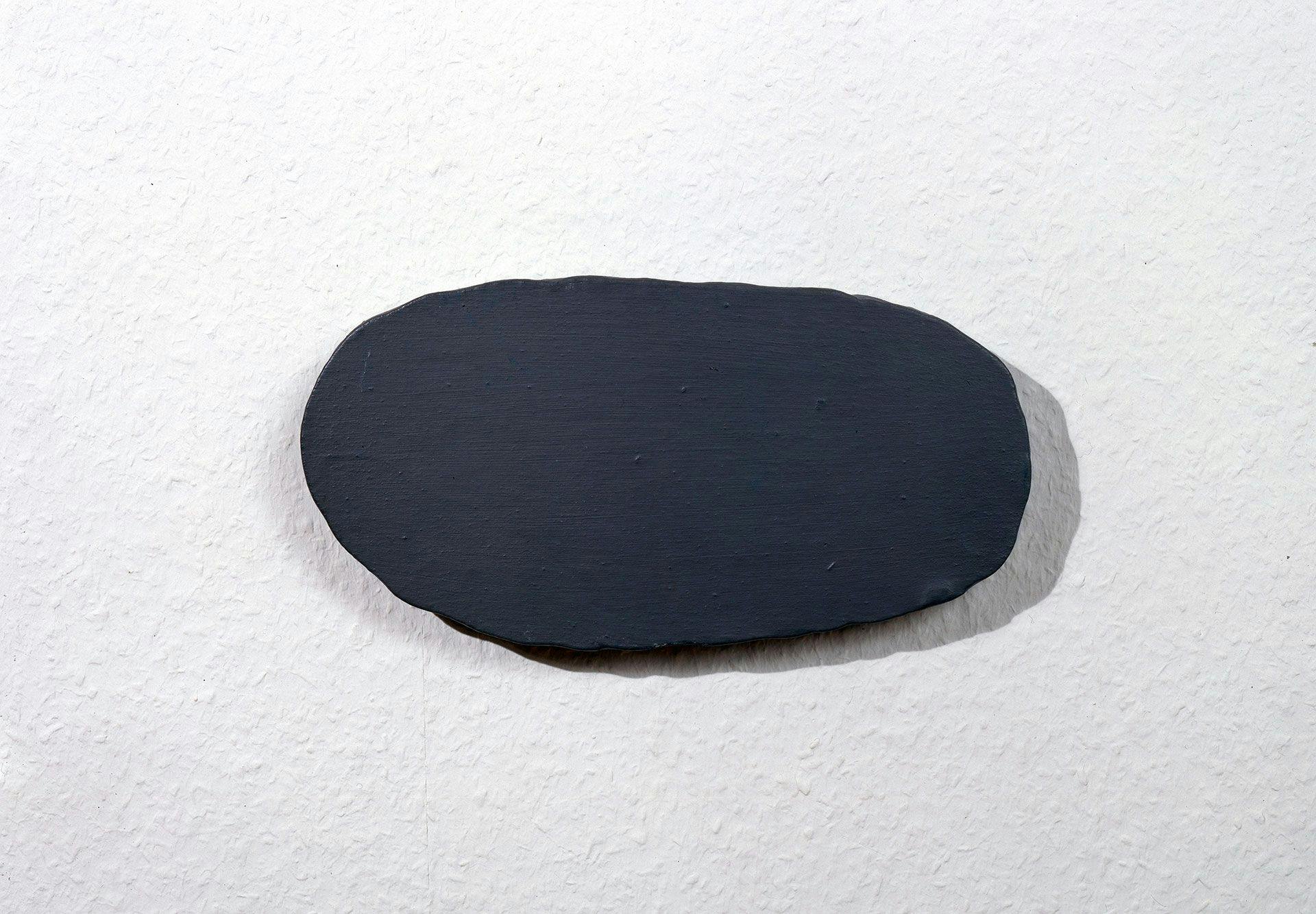 A sculpture by Palermo, titled Graue Scheibe (Grey Disc), dated 1966. 